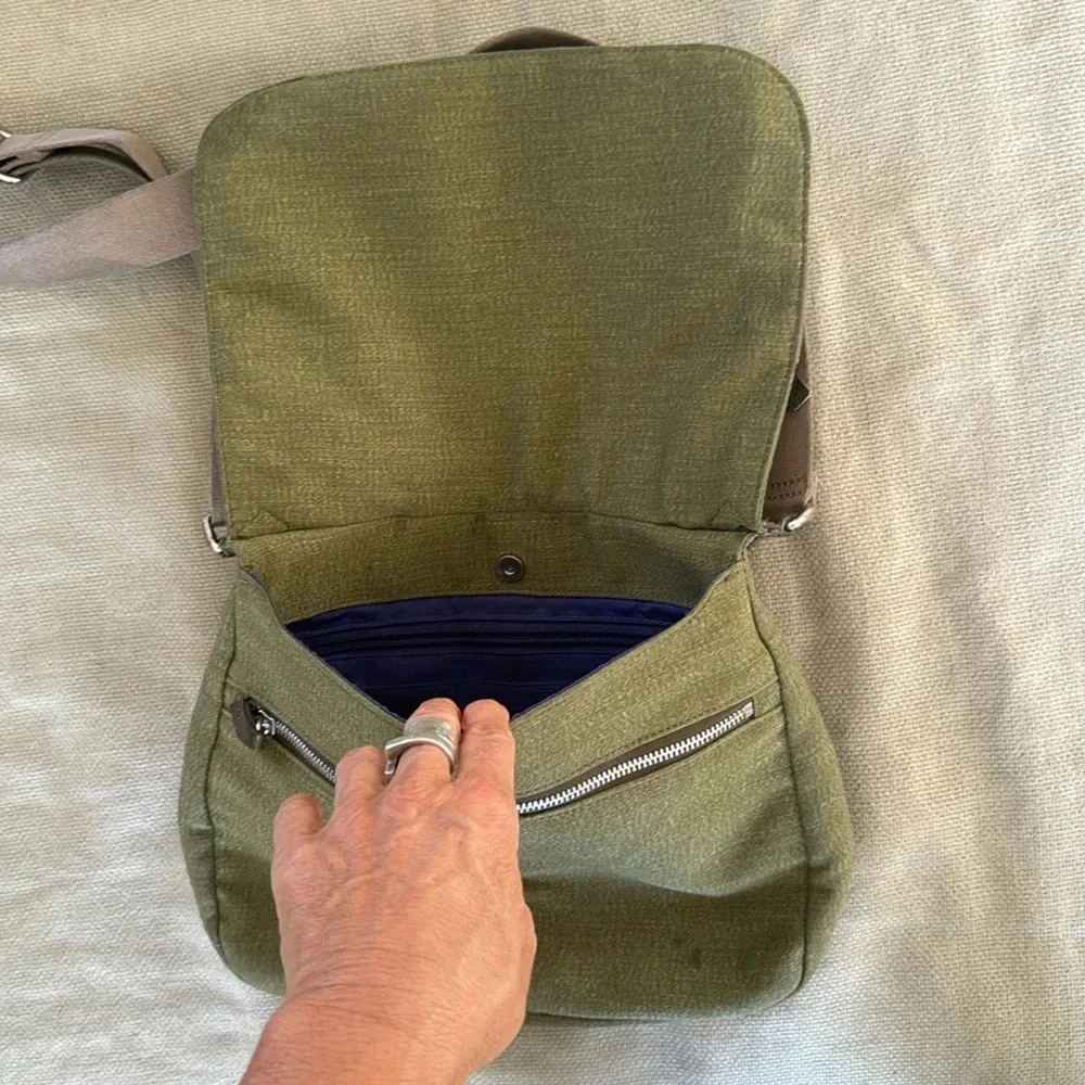 Kipling moss green with colbalt blue lining crossbody bag